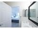 View from bathroom into bedroom with porch access and king bed at 7505 Pellham Way, Kissimmee, FL 34747