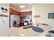 Kitchen featuring stainless steel appliances, dark wood cabinets, and a quartz countertop at 7505 Pellham Way, Kissimmee, FL 34747