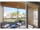 View from screened-in porch overlooking manicured lawn and community at 7505 Pellham Way, Kissimmee, FL 34747