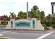Oakwater community sign with palm trees and lush landscaping creates a welcoming entrance at 7505 Pellham Way, Kissimmee, FL 34747