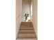 Bright staircase featuring wood steps and white railing, decorated with a playful Mickey Mouse decal at 7505 Pellham Way, Kissimmee, FL 34747