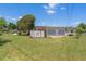 A sunny backyard with a shed and plenty of room for outdoor activities at 7700 Grevillea Dr, Orlando, FL 32822