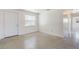 Bright, airy living area with a front door and terrazzo floors at 7700 Grevillea Dr, Orlando, FL 32822