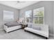 Bedroom featuring a bed, window, and couch at 8263 Bellow St, Orlando, FL 32827