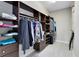 A spacious walk-in closet with custom shelves and storage at 8263 Bellow St, Orlando, FL 32827