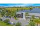 Aerial view of a community center with a lake in the background at 8263 Bellow St, Orlando, FL 32827