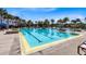 Community Pool featuring a lap pool, palm trees, and lounge seating for relaxing by the water at 8263 Bellow St, Orlando, FL 32827