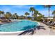 Community pool with lounge chairs and covered cabanas at 8263 Bellow St, Orlando, FL 32827