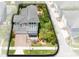 Aerial view of a modern two-story home showcasing a brick driveway, a two-car garage, and mature landscaping at 8263 Bellow St, Orlando, FL 32827