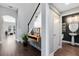 Hallway and staircase featuring neutral paint, wood floors, and modern decor at 8263 Bellow St, Orlando, FL 32827