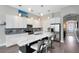 Modern kitchen featuring stainless steel appliances, a large island, and white cabinetry at 8263 Bellow St, Orlando, FL 32827