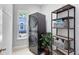 Laundry room with a stackable washer and dryer and a shelving unit at 8263 Bellow St, Orlando, FL 32827