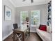 Cozy home office featuring natural light, neutral decor, and comfortable furniture at 8263 Bellow St, Orlando, FL 32827