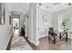 Bright home office with hardwood floors, large windows and a view to the front of the home at 8263 Bellow St, Orlando, FL 32827
