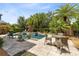 Gorgeous outdoor pool and patio area with seating, landscaping and resort style elegance at 8263 Bellow St, Orlando, FL 32827