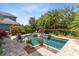 Outdoor pool and lounging area with a manicured yard, perfect for backyard entertainment at 8263 Bellow St, Orlando, FL 32827