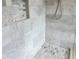 Stylish walk-in shower featuring marble walls and honeycomb tile floor, offering a modern design at 8263 Bellow St, Orlando, FL 32827