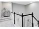 Stairway featuring carpeted steps, white banister spindles, wood railing and neutral wall paint at 8263 Bellow St, Orlando, FL 32827