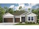 Charming single-Gathering home with a two-car garage, well-manicured lawn, and inviting curb appeal at 857 Junonia Blvd, New Smyrna Beach, FL 32168