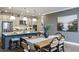 Beautiful kitchen with an island that adjoins the dining area featuring stainless appliances and plentiful countertop space at 857 Junonia Blvd, New Smyrna Beach, FL 32168