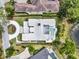 Bird's eye view of the property reveals meticulously landscaped grounds and luxurious pool at 9364 Thurloe Pl, Orlando, FL 32827