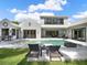 Beautiful backyard with pool, patio, outdoor seating and an outdoor kitchen area at 9364 Thurloe Pl, Orlando, FL 32827