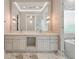 Luxurious bathroom with marble countertop, dual sinks, and a freestanding tub at 9364 Thurloe Pl, Orlando, FL 32827