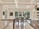 A large table and chairs under decorative lighting offer views of the beautiful outdoors at 9364 Thurloe Pl, Orlando, FL 32827
