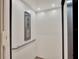 Inside elevator with handrails, recessed lighting, and control panel for ease of access at 9364 Thurloe Pl, Orlando, FL 32827
