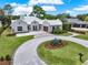 Stunning home featuring a circular driveway, elegant landscaping, and a three-car garage at 9364 Thurloe Pl, Orlando, FL 32827