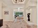 Bright foyer features marble floors, modern lighting, and a seamless view to the living room and outdoor pool at 9364 Thurloe Pl, Orlando, FL 32827