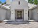Grand entrance featuring symmetrical fountains, a paved walkway, and elegant lighting fixtures at 9364 Thurloe Pl, Orlando, FL 32827