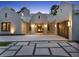 Striking front entrance with contemporary design, patterned driveway, and modern lighting at 9364 Thurloe Pl, Orlando, FL 32827
