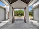 Open entryway features stone flooring, modern architecture, and a picturesque view of the front yard at 9364 Thurloe Pl, Orlando, FL 32827