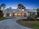 Inviting front exterior with landscaped circular driveway and modern architectural details at 9364 Thurloe Pl, Orlando, FL 32827