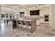 Bright, open kitchen with bar seating and open to dining area, featuring marble floors and recessed lights at 9364 Thurloe Pl, Orlando, FL 32827