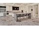 Bright, open kitchen featuring an island with bar seating and modern stainless steel appliances at 9364 Thurloe Pl, Orlando, FL 32827