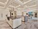 Modern kitchen with islands, marble floors, and an open concept design at 9364 Thurloe Pl, Orlando, FL 32827