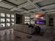 Stylish living room featuring a cozy sofa, coffered ceiling, fireplace, and decorative niches at 9364 Thurloe Pl, Orlando, FL 32827