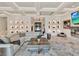 Open living room featuring unique wall niches, recessed lighting, and a comfortable white sofa at 9364 Thurloe Pl, Orlando, FL 32827