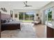Bright and airy bedroom with large windows and a view of the backyard at 9364 Thurloe Pl, Orlando, FL 32827