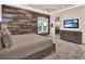Bedroom with wood accent wall and a spacious layout at 9364 Thurloe Pl, Orlando, FL 32827