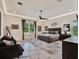 A generously sized main bedroom featuring recessed lighting, a plush bed, and marble floors at 9364 Thurloe Pl, Orlando, FL 32827