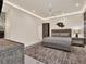 A beautifully appointed main bedroom with a decorative ceiling fan and a modern rug at 9364 Thurloe Pl, Orlando, FL 32827