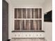 Functional mudroom with custom built-in bench, storage, and coat hooks for organization at 9364 Thurloe Pl, Orlando, FL 32827