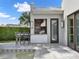 Outdoor kitchen area with a built-in grill, adjacent to the pool for easy entertaining at 9364 Thurloe Pl, Orlando, FL 32827