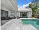 Relaxing outdoor patio with lounge seating, offering a serene poolside experience at 9364 Thurloe Pl, Orlando, FL 32827