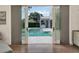 View of the pool and backyard from sliding glass doors at 9364 Thurloe Pl, Orlando, FL 32827