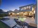 Relaxing backyard oasis boasts a luxurious pool, fire feature, and comfortable lounge seating at 9364 Thurloe Pl, Orlando, FL 32827