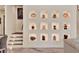 Intricate wall decor with art niches and a staircase with accent lights at 9364 Thurloe Pl, Orlando, FL 32827